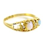 An 18ct gold opal and diamond dress ring, set with three opals (one missing) and two diamonds,