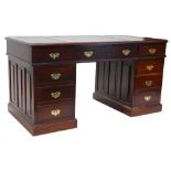 A continental hardwood pedestal desk, the rectangular top with three green tooled leather skivers,