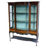 An Edwardian mahogany and checker banded display cabinet, with a shaped top, a bow fronted central