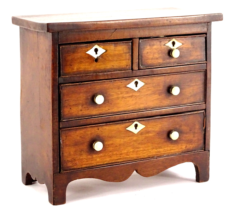 A 19thC miniature mahogany chest of drawers, with two short and three long drawers, each with bone