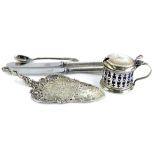 A collection of small silver and white metal items, to include a cylindrical mustard pot, with