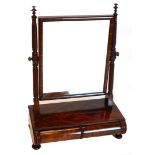 An early Victorian figured mahogany dressing table mirror, the rectangular plate on spirally