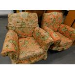 Two armchairs in floral material, 93cm wide, with serpentine backs, raised front seats and block