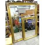 A gilt rectangular wall mirror, with bevelled plate, 138cm x 105cm, and another.