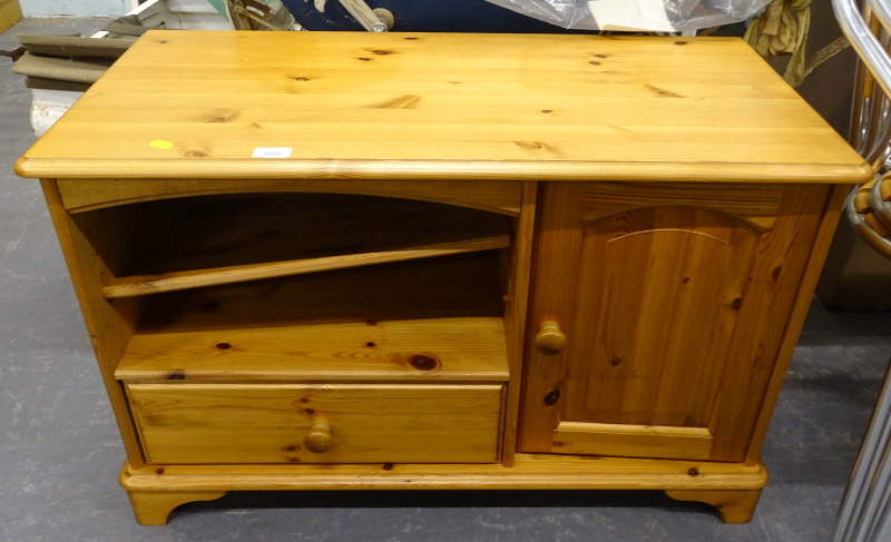 A small pine TV cabinet.