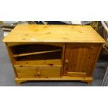 A small pine TV cabinet.