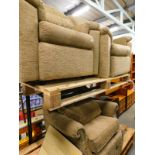 Three armchairs with beige fabric, a folding table and two stained pine coffee tables on castors.