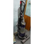 A Dyson DC25 upright vacuum cleaner.