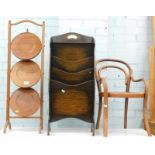 A mahogany three tier folding cake stand, an oak magazine rack, and a small childs bentwood chair,