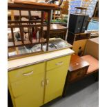 A vintage kitchen cabinet, of rectangular form, with yellow drawers and cupboards, 85cm high,