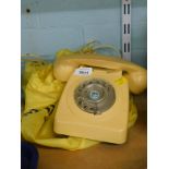 An ivory coloured BT telephone, numbered 746F/DFM75/1.