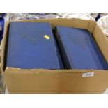 Various volumes of Arthur Mee's Children's Encyclopedia, with blue leather bindings.