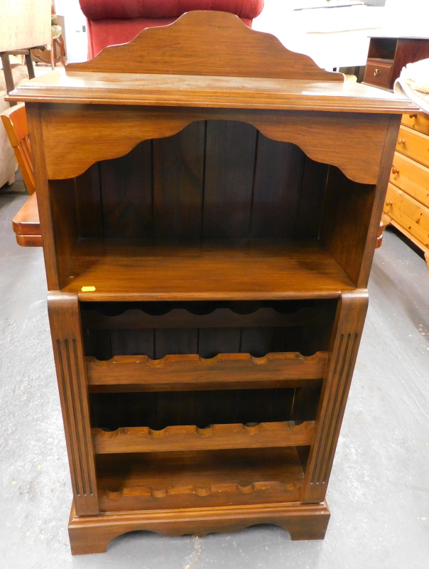 A mahogany wine rack, with raised back and shelves for bottles etc.