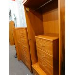 An Alston's Furniture bedroom suite, comprising wardrobe, compactum chest, and a pedestal cabinet,