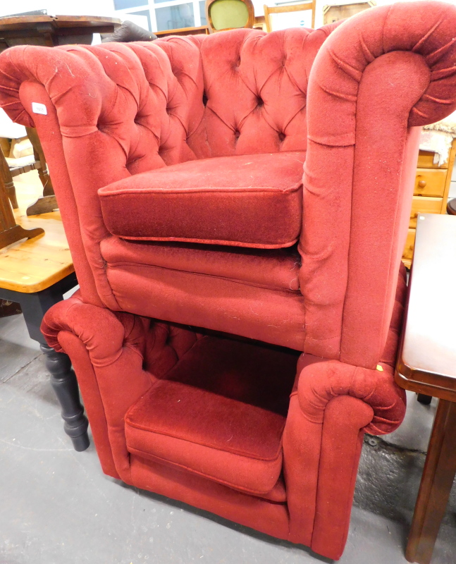 Two button back armchairs, in maroon draylon fabric.