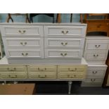 A collection of white melamine bedroom furniture, to include dressing table, six drawer unit, a pair