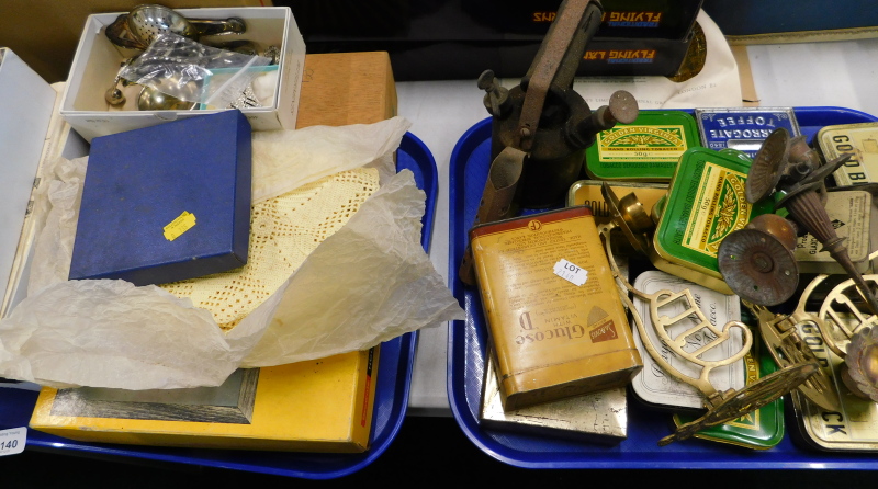 Miscellaneous bygones, to include various tins, two sets of candle arms for a piano, various boxed