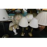 A large quantity of table lamps, to include terracotta, brass effect etc. (AF).