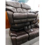 A two piece electric reclining lounge suite, comprising three and two seater settees' in dark