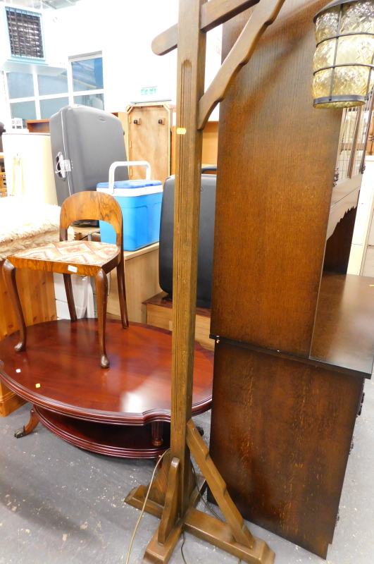 An Art Deco low back chair, oval topped occasional table, and an oak lantern standard lamp.