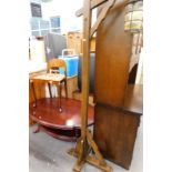 An Art Deco low back chair, oval topped occasional table, and an oak lantern standard lamp.