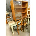A painted pine kitchen table, a teak book case with glass doors, Victorian balloon back chair,