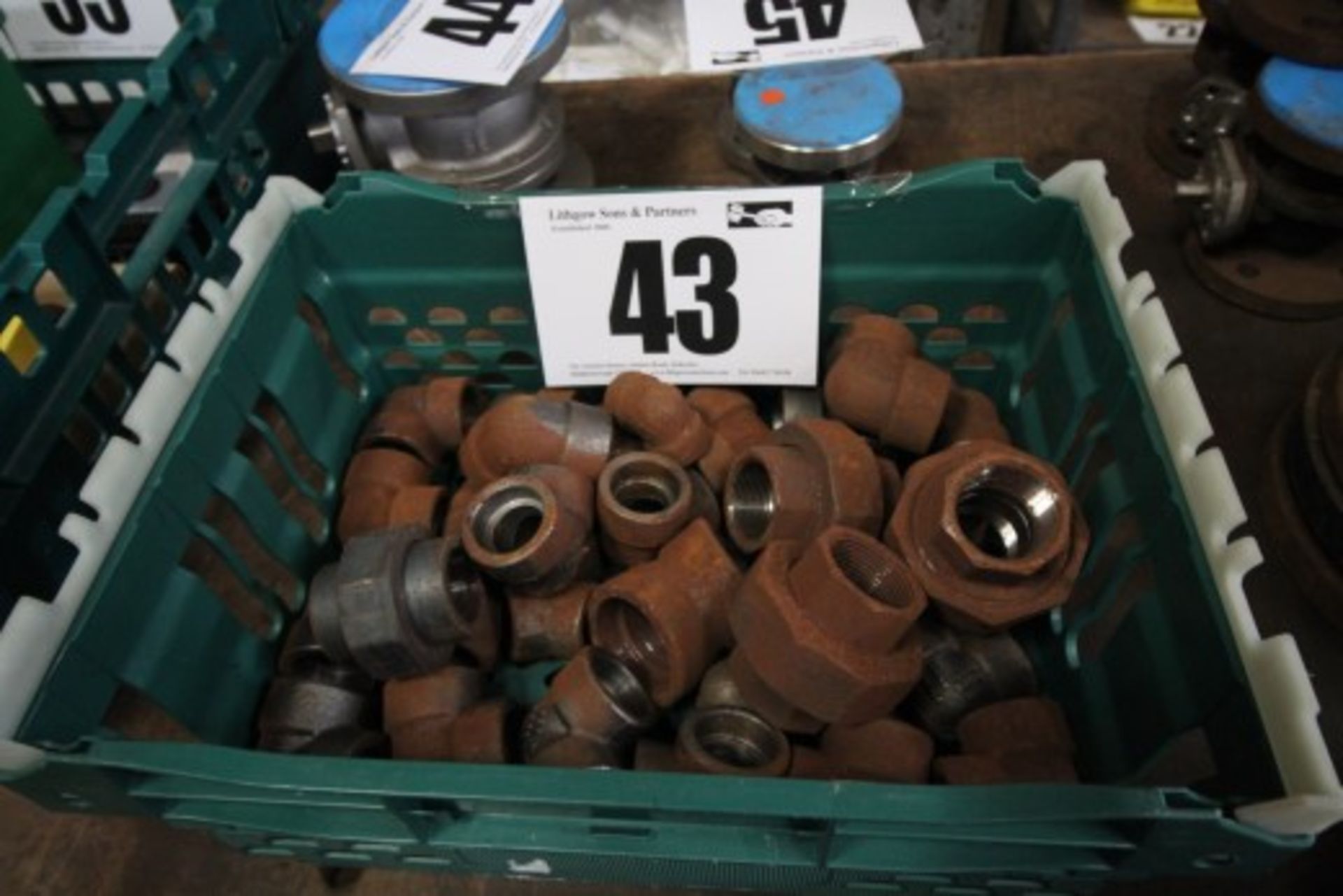 Box and Contents of Mild Steel, Small and Medium Size Pipe Fittings.