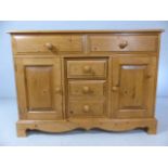 Pine sideboard unit with two cupboards and five drawers