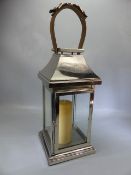 Modern chrome lantern with cream candle