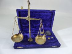 Brass cased weighing scales with weights