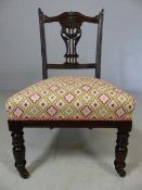 Newly re-upholstered Edwardian mahogany bedroom chair on castors