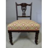 Newly re-upholstered Edwardian mahogany bedroom chair on castors