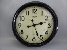 Black metal wall clock marked Camden Clocks London, approx. 47 cm wide