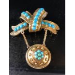 Gold coloured mourning brooch in the form of a twisted ribbon decorated with Turquoise stones and