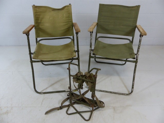 Two commando post folding chairs and a radio carrier