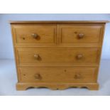 Low pine chest of four drawers