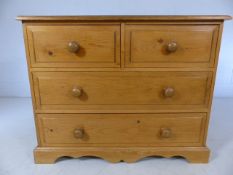 Low pine chest of four drawers