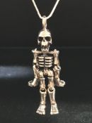 Silver articulated skeleton pendant necklace on silver chain