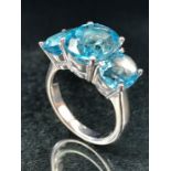 Silver and blue topaz three stone ring