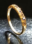 Yellow gold sapphire and diamond ring