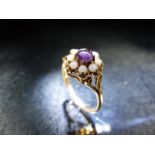 9ct Gold Ladies daisy ring set with seed pearls and a central Amethyst