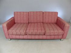 Red patterned retro-style three seater sofa