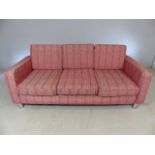 Red patterned retro-style three seater sofa