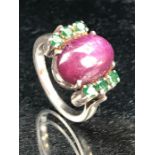 Large Cabochon Oval star Ruby ring with tourmaline stones to the shoulders