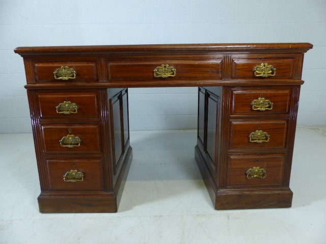 Pedestal desk with green leather top and three drawers under