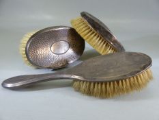 Three Silver backed Birmingham hallmarked brushes