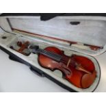 Violin in grey felt lined case, approx. 55cm in length.