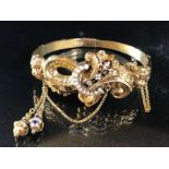 Gold and enamel Renaissance Rival Hinged Bangle set with seed pearls
