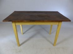 Small French rustic table with cream-painted legs