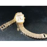 Longines: a 9ct yellow gold ladies' wristwatch with 9ct gold bracelet strap, dial set with baton